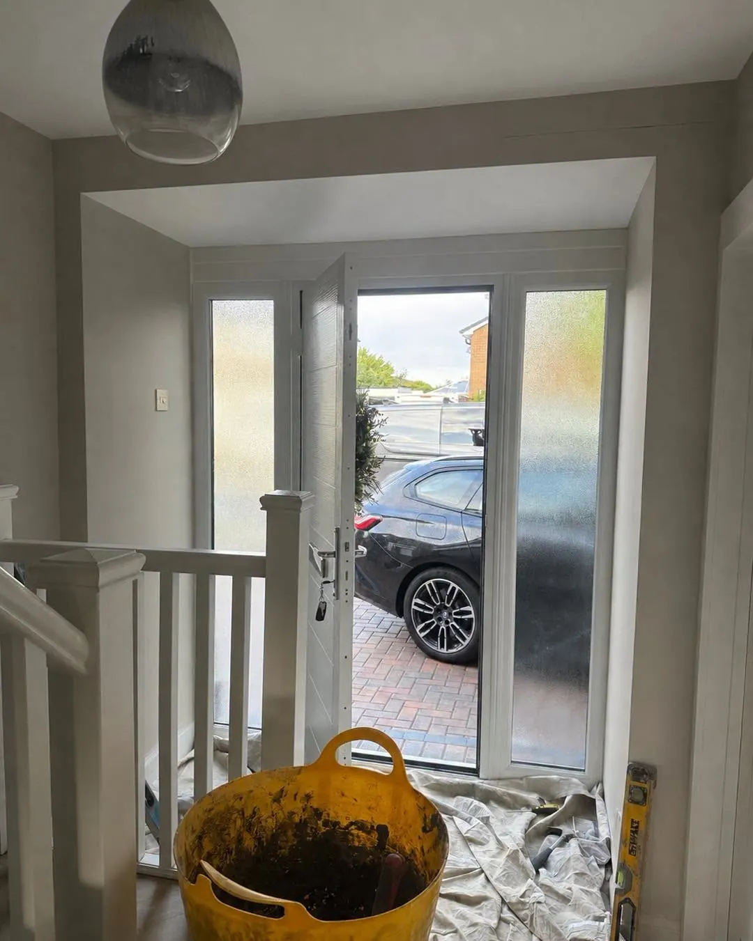 Hallway before brick slip installation, walls prepared and floors protected