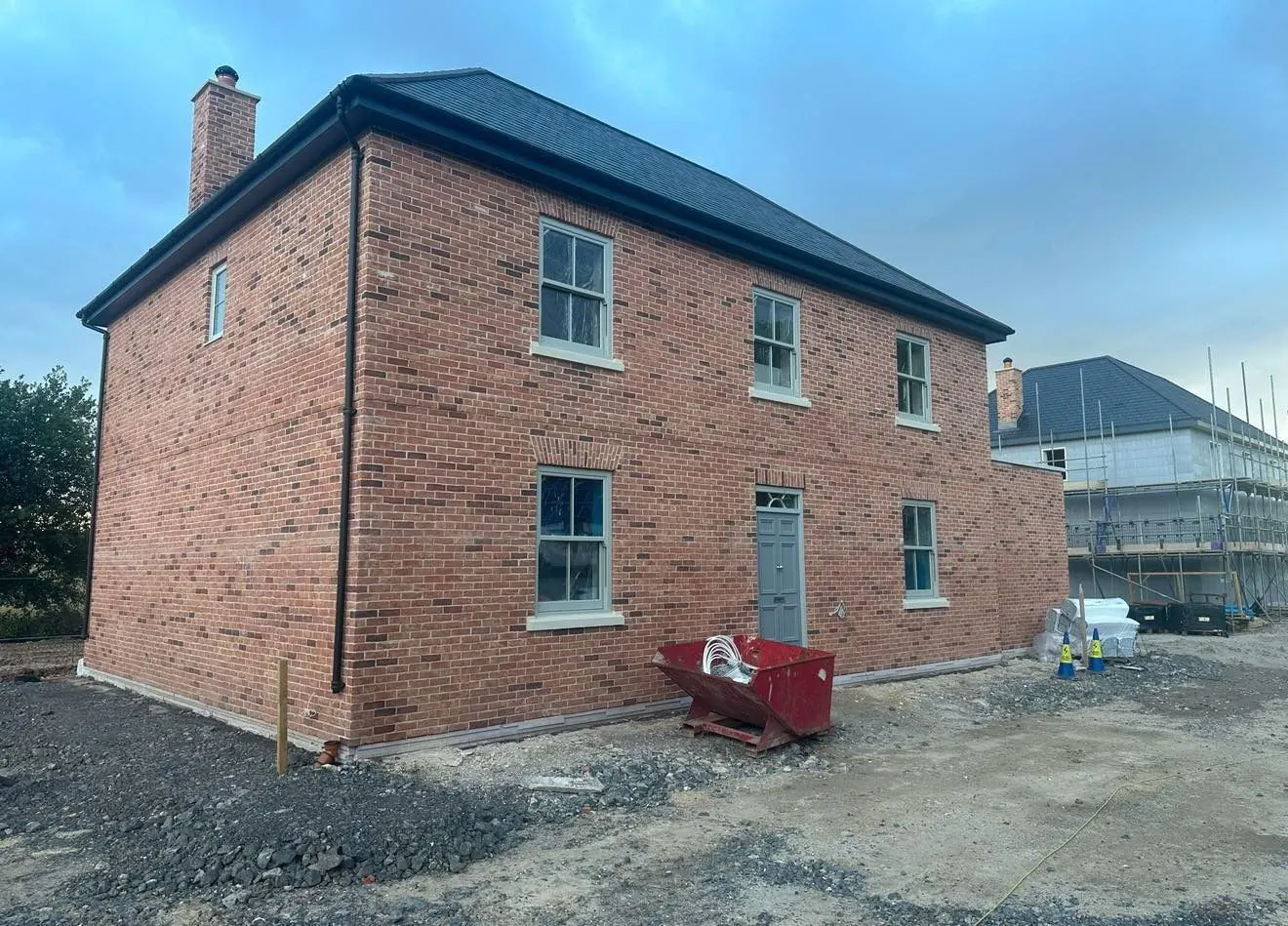 Completed red brick new-build house built by Bespoke Brickwork