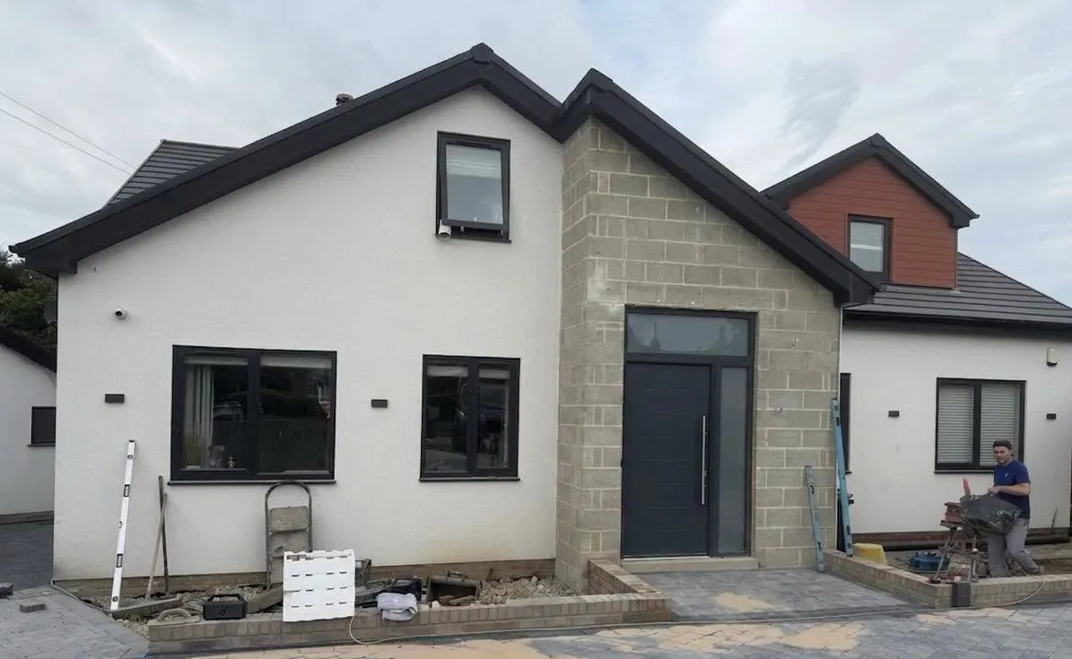 House entrance porch before brick slip cladding, showing bare blockwork