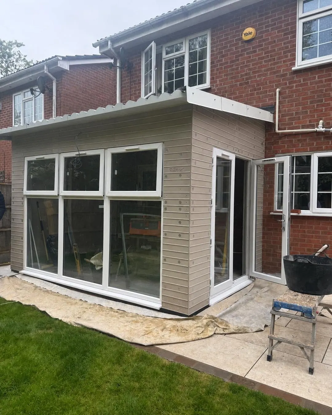 House extension before brick slip cladding, showing rendered boards