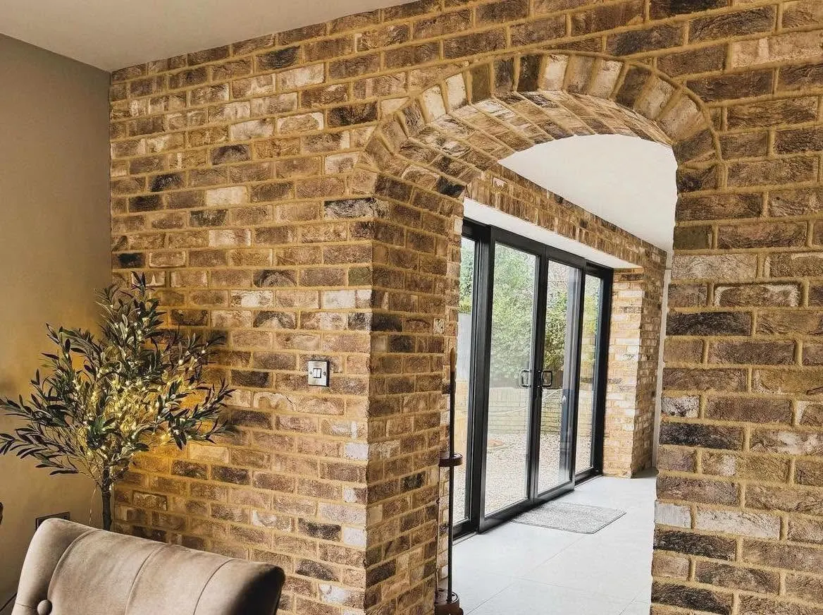 Brick slip archway and corner detailing between two rooms