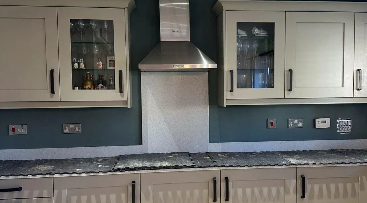 Cream kitchen before the red brick slip splashback was fitted